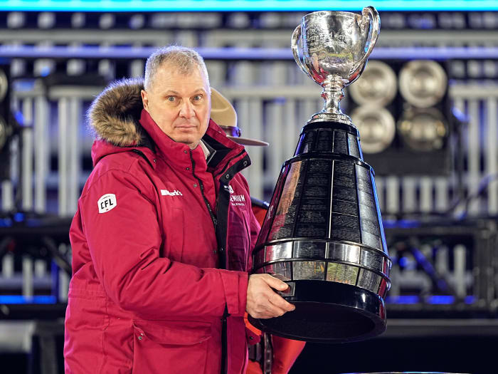 Dec 12, 2021; Hamilton, Ontario, CAN; Canadian Football League commissioner Randy Ambrosie goes to present the Grey Cup to the Winnipeg Blue Bombers after a win over the Hamilton Tiger-Cats in the 108th Grey Cup football game at Tim Hortons Field. Mandatory Credit: John E. Sokolowski-USA TODAY Sports